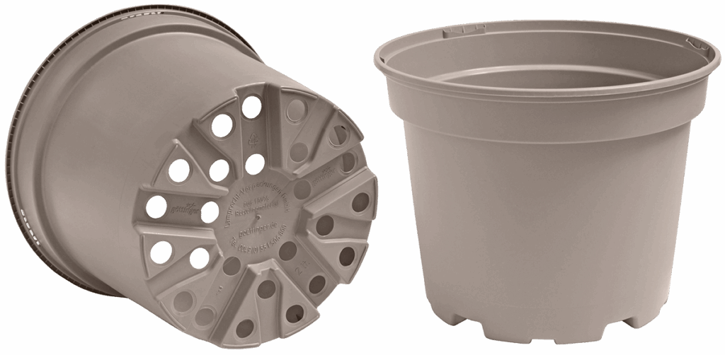 Two plastic flower pots with holes in the bottom