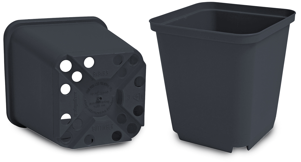 Black plastic plant pots for garden plants.